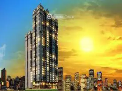 a tall building with a clock on top of it at Cozy 1 Bedroom Apartment for Long Term Rentals in Manila