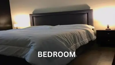 a bedroom with a bed with a white bedspread at Cozy 1 Bedroom Apartment for Long Term Rentals in Manila