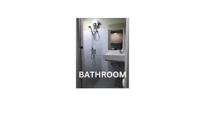 a bathroom with a mirror and a sink at Cozy 1 Bedroom Apartment for Long Term Rentals in Manila