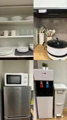 a kitchen with a microwave oven and a refrigerator at 153 Urban Escape in Manila