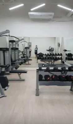 a gym with several rows of tread machines in a room at Lorde's Hideaway in Manila