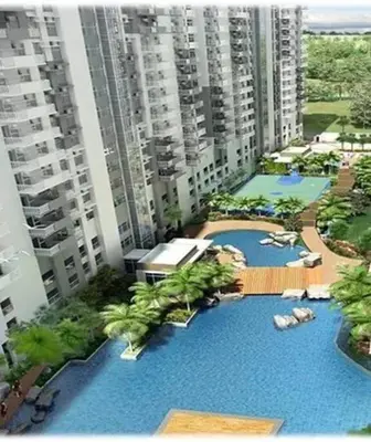 an overhead view of a large swimming pool with tall buildings at Lovely two bedroom apartment with balconies in Manila
