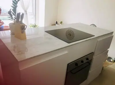 a kitchen counter with a sink on top of it at Lovely two bedroom apartment with balconies in Manila