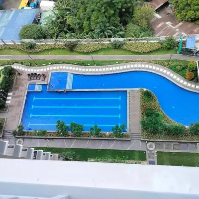 an overhead view of a swimming pool on a building at Satori Residence in Manila