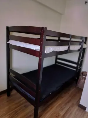 a couple of bunk beds in a room at Satori Residence in Manila