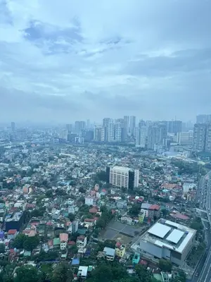 an aerial view of a city with buildings at Elegant 4BR with balcony and bathtub in Uptown BGC in Manila