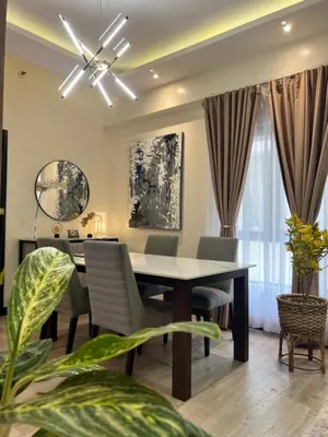 a dining room with a table and chairs at 1 Bedroom Penthouse Condo Near Airport NAIA in Manila