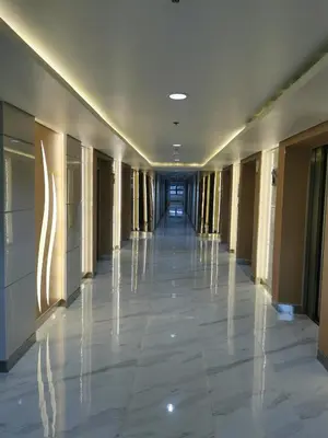 a hallway of a building with a long corridor at Mall of Asia Pasay Shore 3 Residence in Manila
