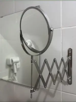 a mirror hanging on a wall in a bathroom at POEA Mega Mall WiFi Netflix in Manila