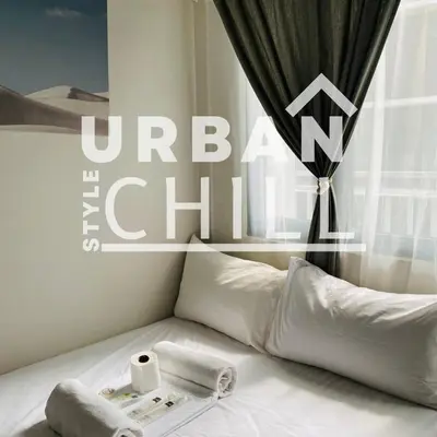 a white bed with a roll of toilet paper on it at Urban Style Chill, Shore 3, MOA Complex, Pasay, Manila in Manila