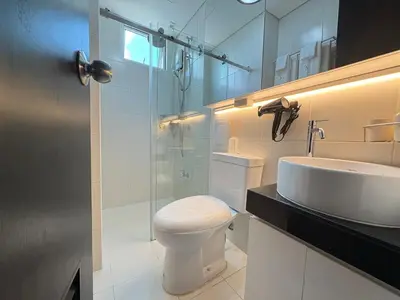 a bathroom with a toilet and a sink and a shower at San Lorenzo Place Mall & Residences Tower 3 by Magallanes MRT station Makati in Manila