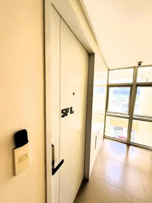 a door in a room with the word stil on it at JFam Suites, C1-5L 1BR , Up To 7 Pax in Biñan