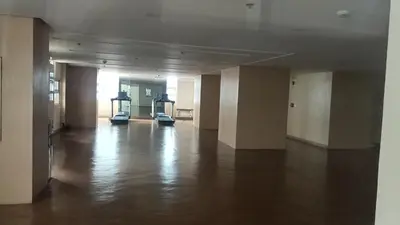 an empty room with two exercise machines in a building at Condotels near and across Terminal3 Airport in Manila