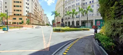 a person walking down a street in a city at Condotels near and across Terminal3 Airport in Manila