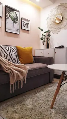 a living room with a couch and a table at 1BR Cozy Condo at Kasara Urban Resort Pasig City in Manila