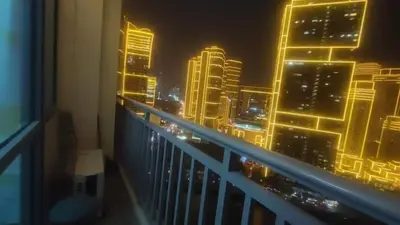 a view of a city at night from a balcony at Aveline Suites, Garden City view, 2br, amenities in Manila