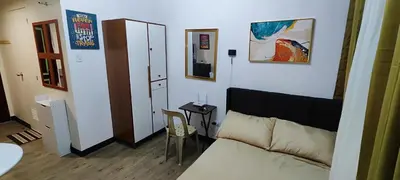 a living room with a couch and a table at Happy Homestay at Fullerton Suites Condo near Nuvali and Tagaytay in Silang