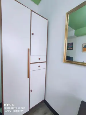 a large white closet with a mirror on the wall at Happy Homestay at Fullerton Suites Condo near Nuvali and Tagaytay in Silang