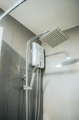 a shower in a bathroom with a shower at The House of Five - Brand New Hotel Style Condo in Manila