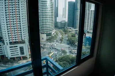 a view from a window of a city at The House of Five - Brand New Hotel Style Condo in Manila