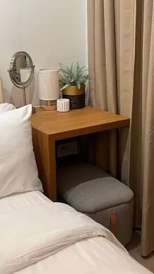 a desk with a chair next to a bed at Lemmon's Casita in Manila