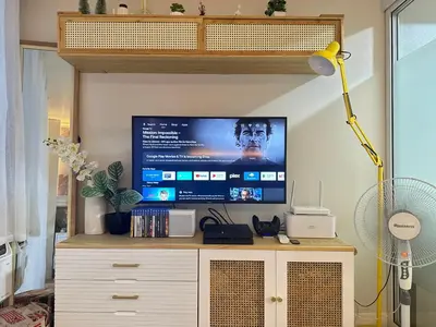 a flat screen tv sitting on top of a cabinet at Azure Urban Beach Residences with PS4 near Airport in Manila