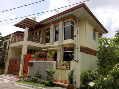 a house with a lot of plants in front of it at Entire house in high end subdivision in Antipolo