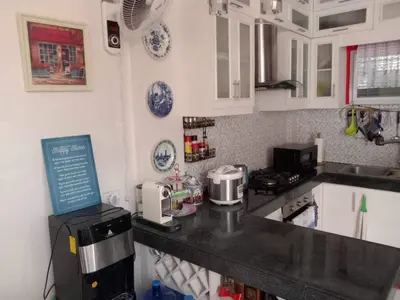 a kitchen with a counter top with a microwave at Entire house in high end subdivision in Antipolo