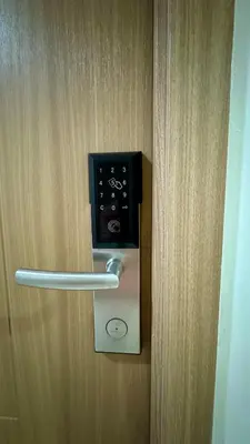 a door with a lock on a wooden door at The GoodVibes Condotel Red Residences Makati in Manila