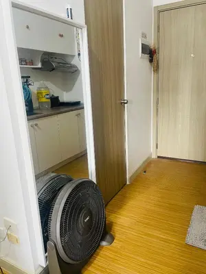 a room with a fan sitting on the floor at SMDC Grace Residences in Manila