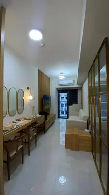 a living room with a couch and a table at Enchanted Gateway by Shore 3 in Manila