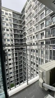 a view of a large apartment building from a balcony at Enchanted Gateway by Shore 3 in Manila