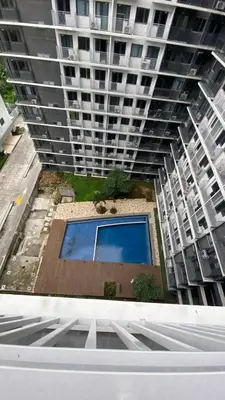 an overhead view of a tall building with a pool at Enchanted Gateway by Shore 3 in Manila