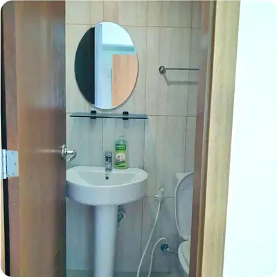 a bathroom with a sink and a mirror at 8 Adriatico Manila Condotel Sea View Corner Unit Near St Lukes Clinic in Manila