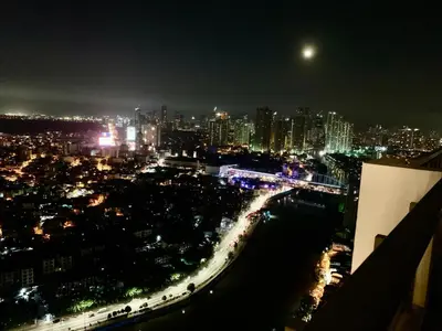 a view of a city at night with lights at Rys Sheridan Tower Mandaluyong in Manila