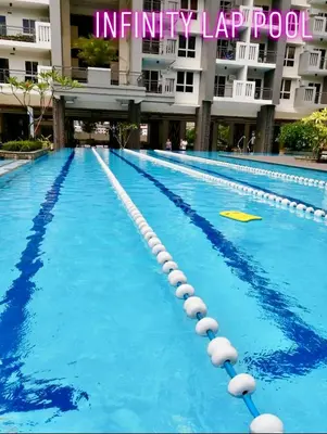 a swimming pool in front of a building at Rys Sheridan Tower Mandaluyong in Manila