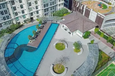 an overhead view of a swimming pool in a building at Cozy 2BR 2Bath San Lorenzo Place Netflix 4KM NAIA in Manila