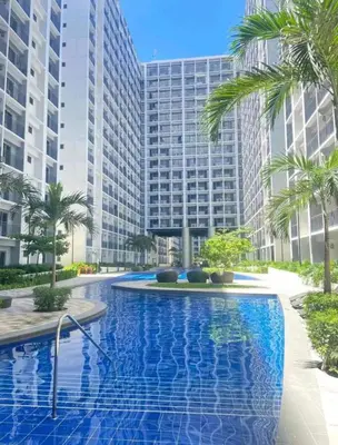 a rendering of a swimming pool in front of a tall building at E & R Staycation Condotel near Mall of Asia in Manila