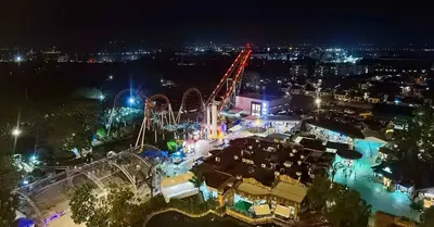 an amusement park at night with a roller coaster at Experience Santa Rosa Comfort at MEGAN Montagne Suite in Santa Rosa