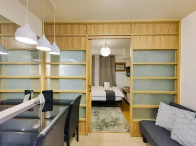 a room with a bed and a room with shelves at 1BR Condotel Ridgewood Towers Taguig City #RW03 in Manila