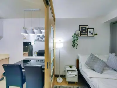 a living room with a couch and a table at 1BR Condotel Ridgewood Towers Taguig City #RW03 in Manila