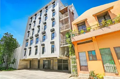 an exterior view of a building at Spot On Classy Bunkbeds Near Makati Manila Formerly MYTOWN Madrid in Manila