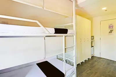 a room with bunk beds in a dorm room at Spot On Hostel ,Taguig Manila Formerly MYTOWN HongKong in Manila