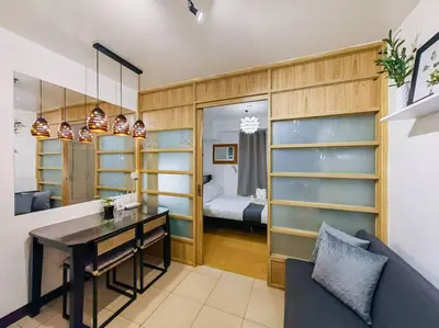 a room with a desk and a room with a bed at 1BR Condotel Ridgewood Towers Taguig City #RW04 in Manila
