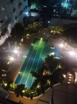 an overhead view of a swimming pool at night at 1BR Condotel Ridgewood Towers Taguig City #RW04 in Manila
