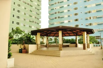 a gazebo in front of a tall building at 1BR Condotel Ridgewood Towers Taguig City #RW05 in Manila