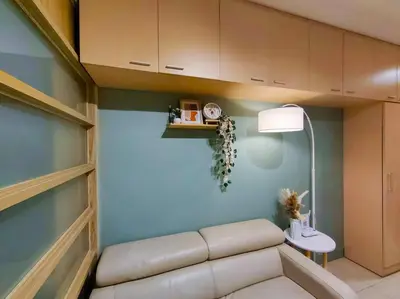 a living room with a couch and a table at 1BR Condotel Ridgewood Towers Taguig City #RW06 in Manila