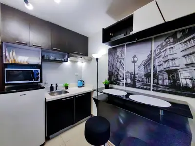 a kitchen with a sink and a microwave at 1BR Condotel Ridgewood Towers Taguig City #RW07 in Manila