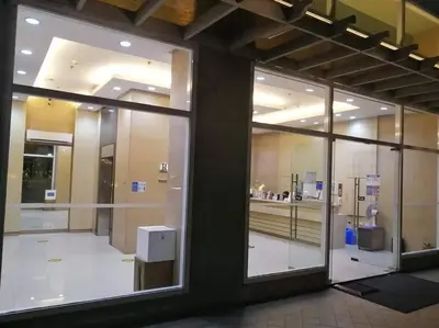 a large glass window of a building with a counter at 1BR Condotel Ridgewood Towers Taguig City #RW08 in Manila