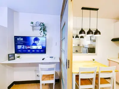 a kitchen and dining room with a table and chairs at 1BR Condotel Ridgewood Towers Taguig City #RW09 in Manila